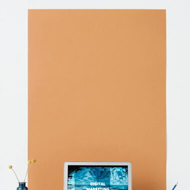 Modern workspace featuring a laptop with a digital marketing screen, ideal for business and technology themes.